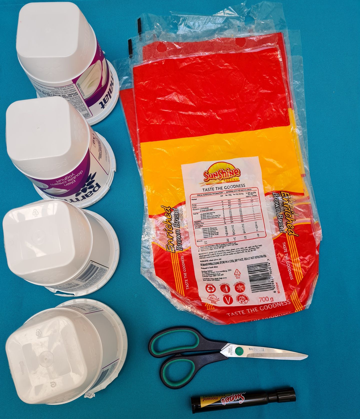 Bread bags, yoghurt cans and scissors