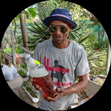 Man presenting a self-made fire extinguisher