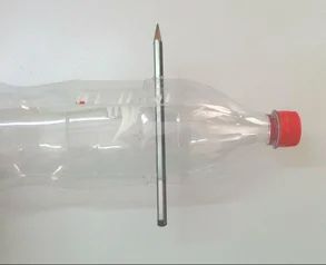 One of the pencils through the holes