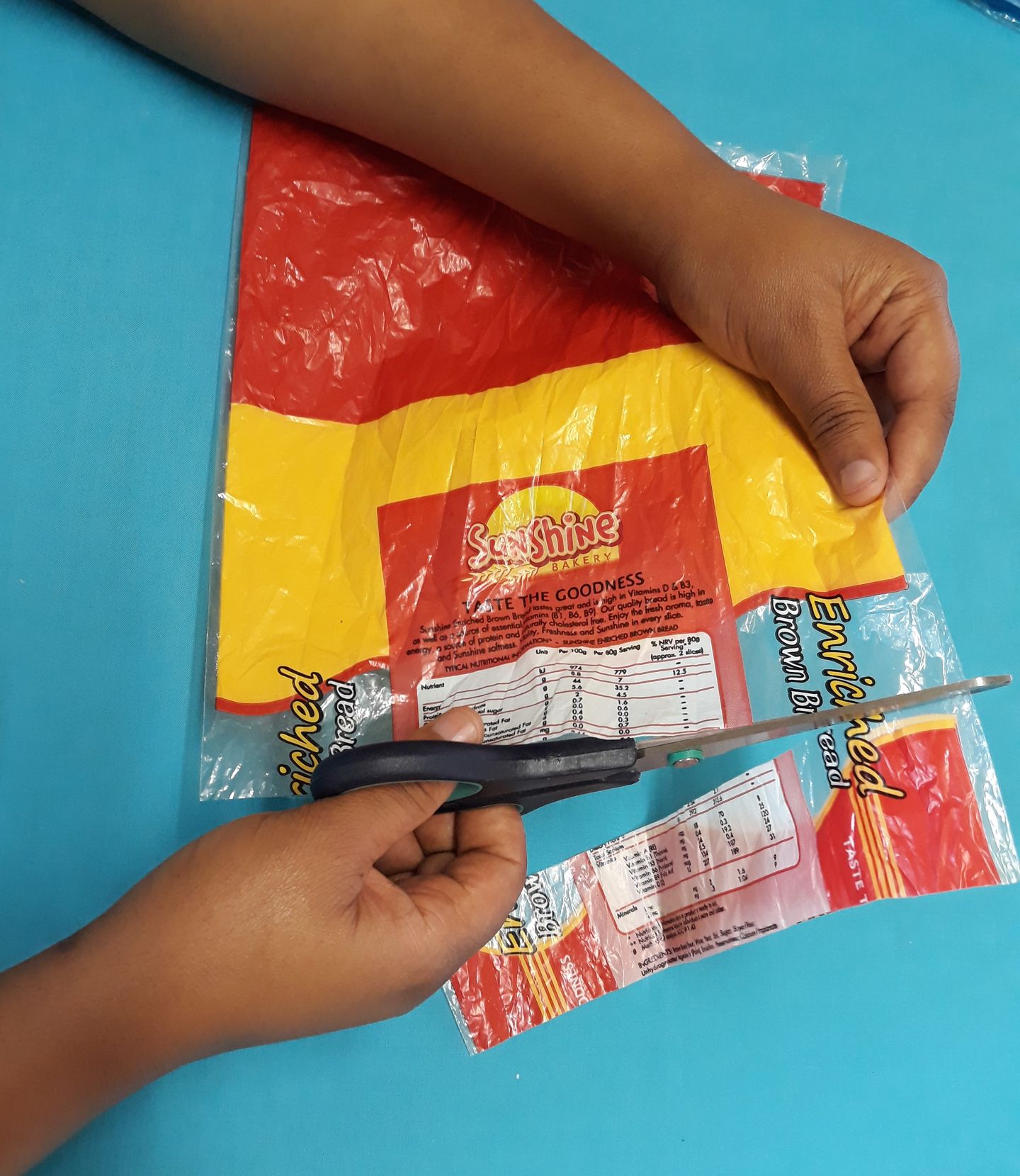 Cutting a 3cm strip straight across the bag making rings