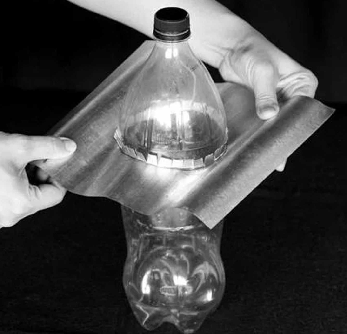 Insert the bottle into the metal sheet