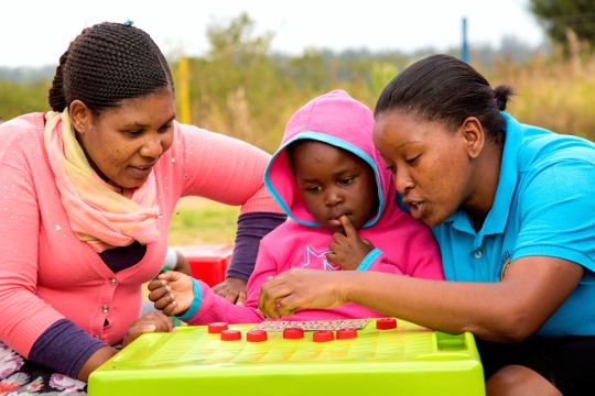 Occupational training. Teachers working with a child