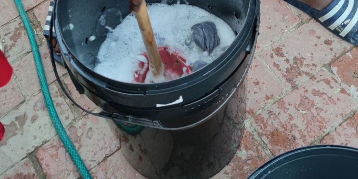 Someone using the self-built washing machine