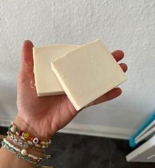 hand with ready made bar soap