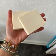hand with ready made bar soap