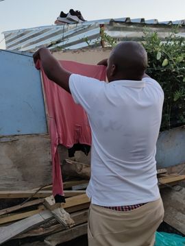 Hanging the laundry into the sun