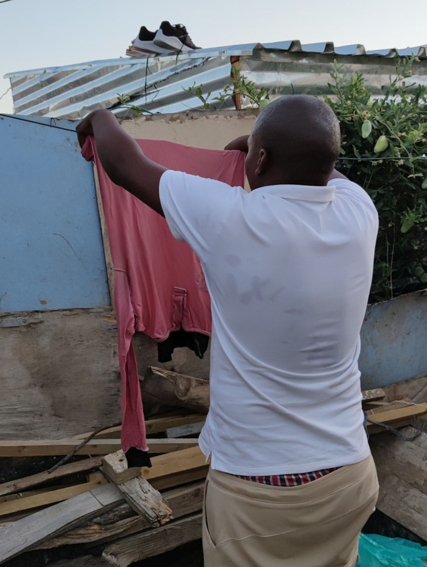 Hanging the laundry into the sun