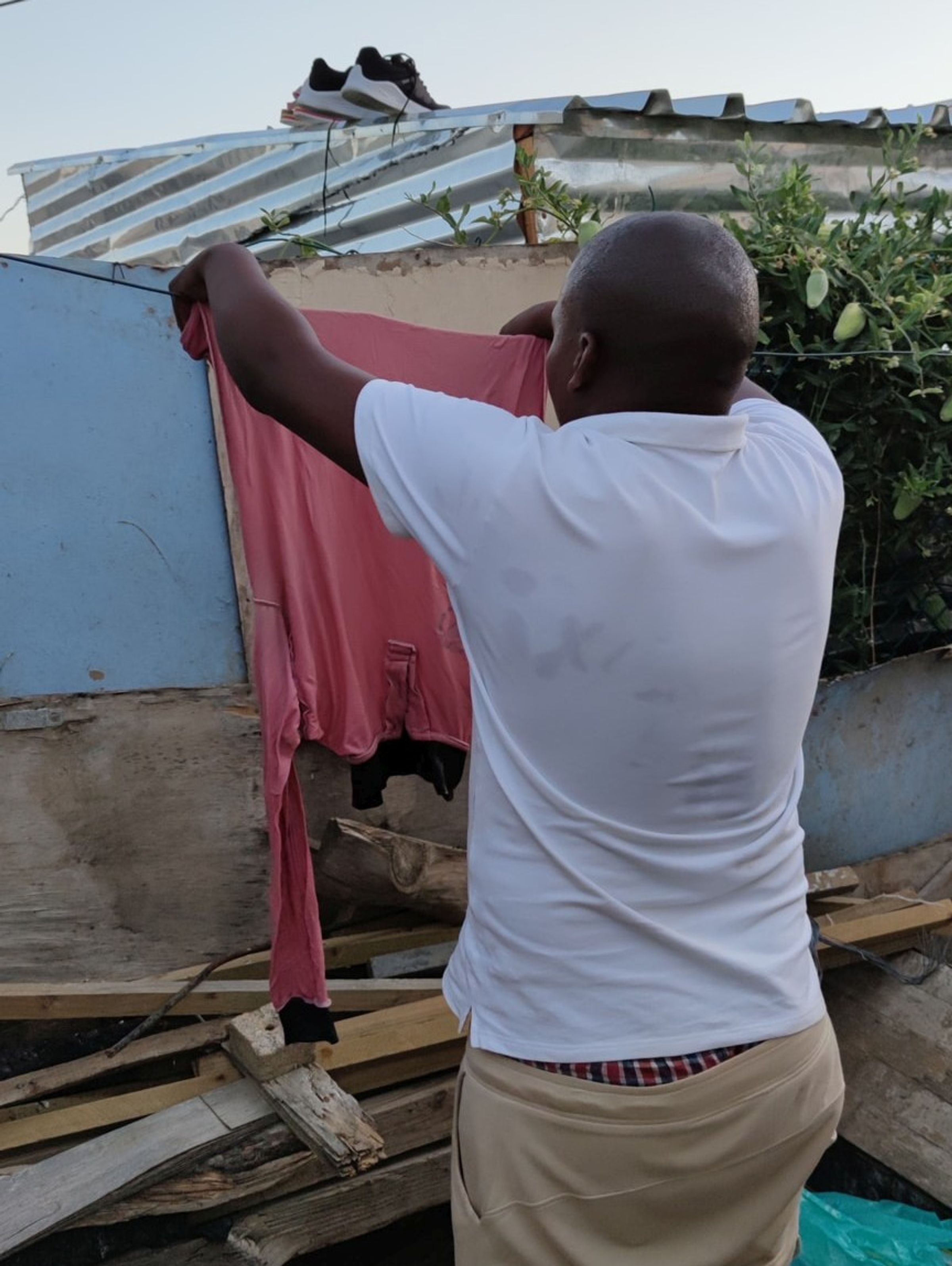 Hanging the laundry into the sun